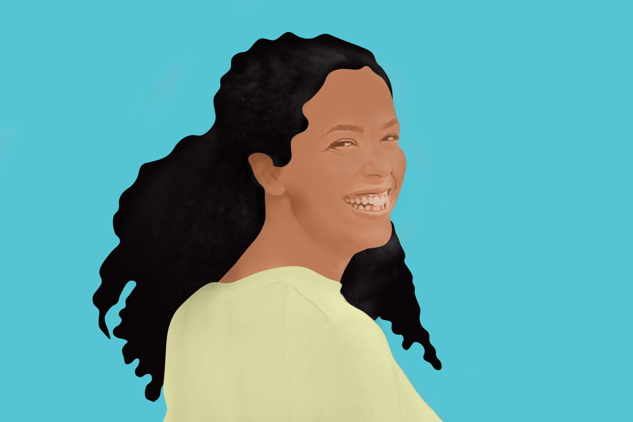 In the cartoon, a smiling woman with curly hair.